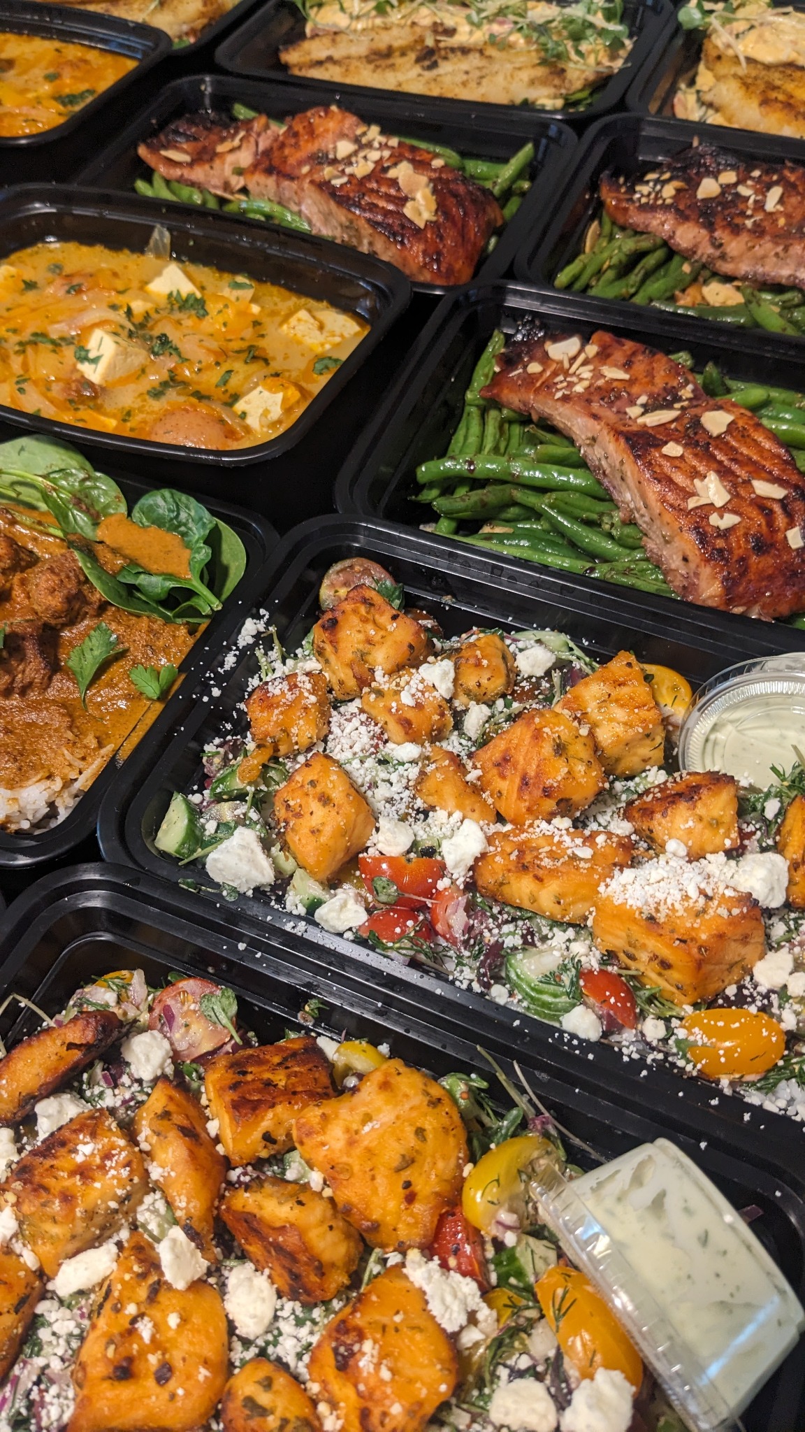 Assorted chef-prepared meal prep dishes